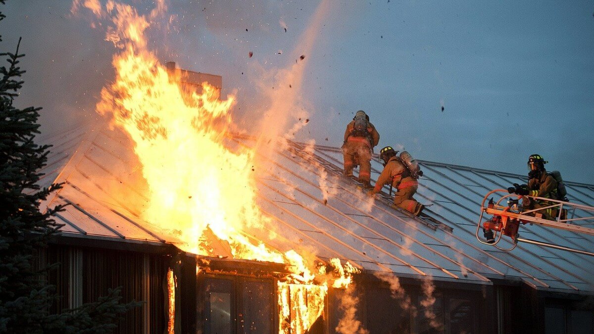 Firemen putting out fire in home