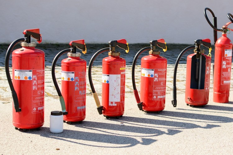 Different sizes of fire extinguishers