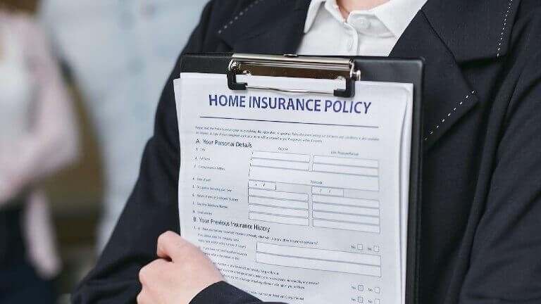A person holding a home insurance policy