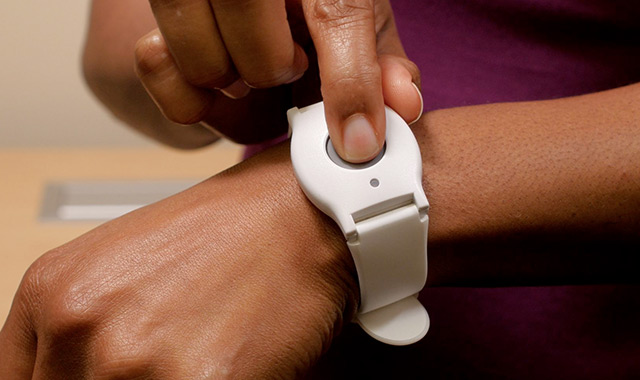Pressing the button of Medical alert bracelet