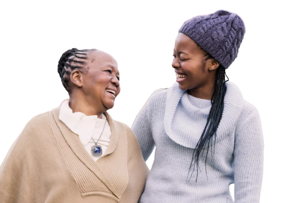An elderly woman wearing medical alert device necklace with a younger woman 